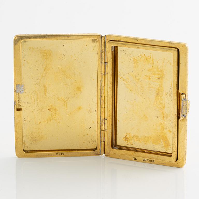 Travel photo album, 18K gold, with monogram.