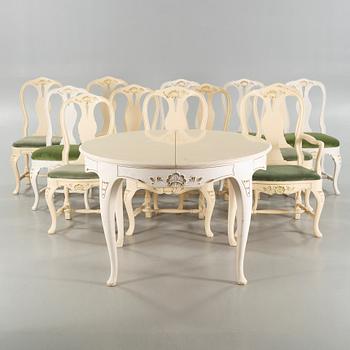 A rococo style table and twelve similar chairs, around the mid 20th century.