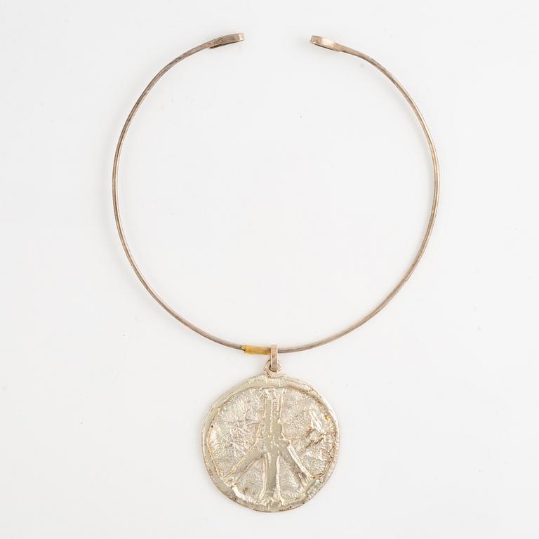 Lars Arby, three neck rings with pendants, silver, Gothenburg including 1977, 1978, and 1982.