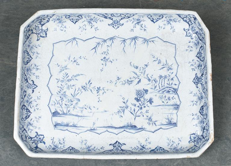 A Swedish Rörstrand faience tea table dated 1745.