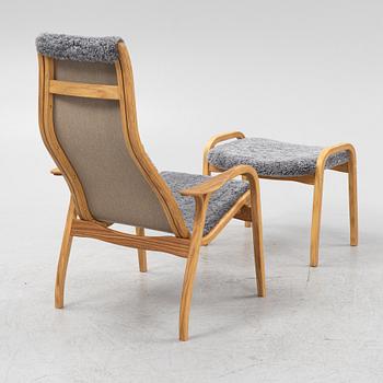 An Yngve Ekström armchair with footstool, "Lamino", Swedese, 21st century.