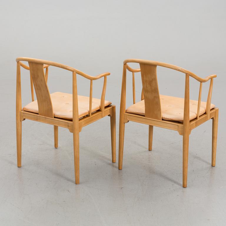 HANS J WEGNER, a pair of armchairs "Kinastolen" Denmark later part of the 20th century.