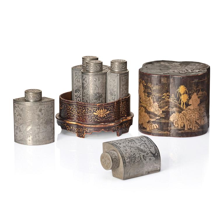 A Chinese lacquer box with a set of five pewter tea caddies, Qing dynasty, 18/19th Century.