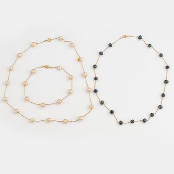 Two cultured pearl necklaces and cultured pearl bracelet.