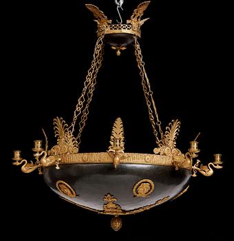 A presumably Russian Empire gilt and patinated bronze nine-branch chandelier, 19th century.