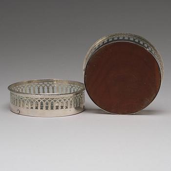 A matched pair of Swedish silver coasters, mark of Gustaf Folcker, Stockholm 1819 and 1826.