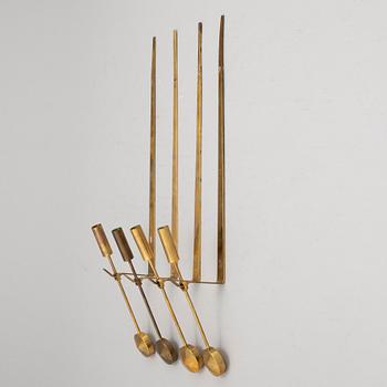 Pierre Forssell, a set of three brass 'Pendeln' wall candle holders from Skultuna.