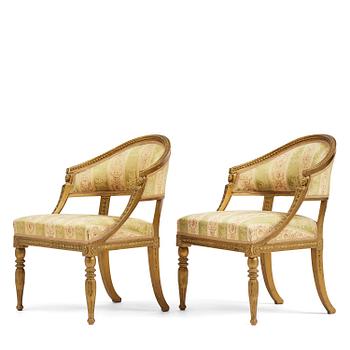 79. A pair of late Gustavian open armchairs attributed to E. Ståhl (master in Stockholm 1794-1820).