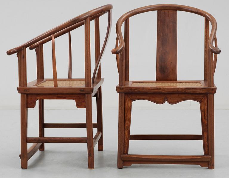 A pair of hardwood horseshoeback armchairs, Qing dynasty.