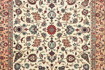 An oriental silk carpet, a. 280 x 185 cm.