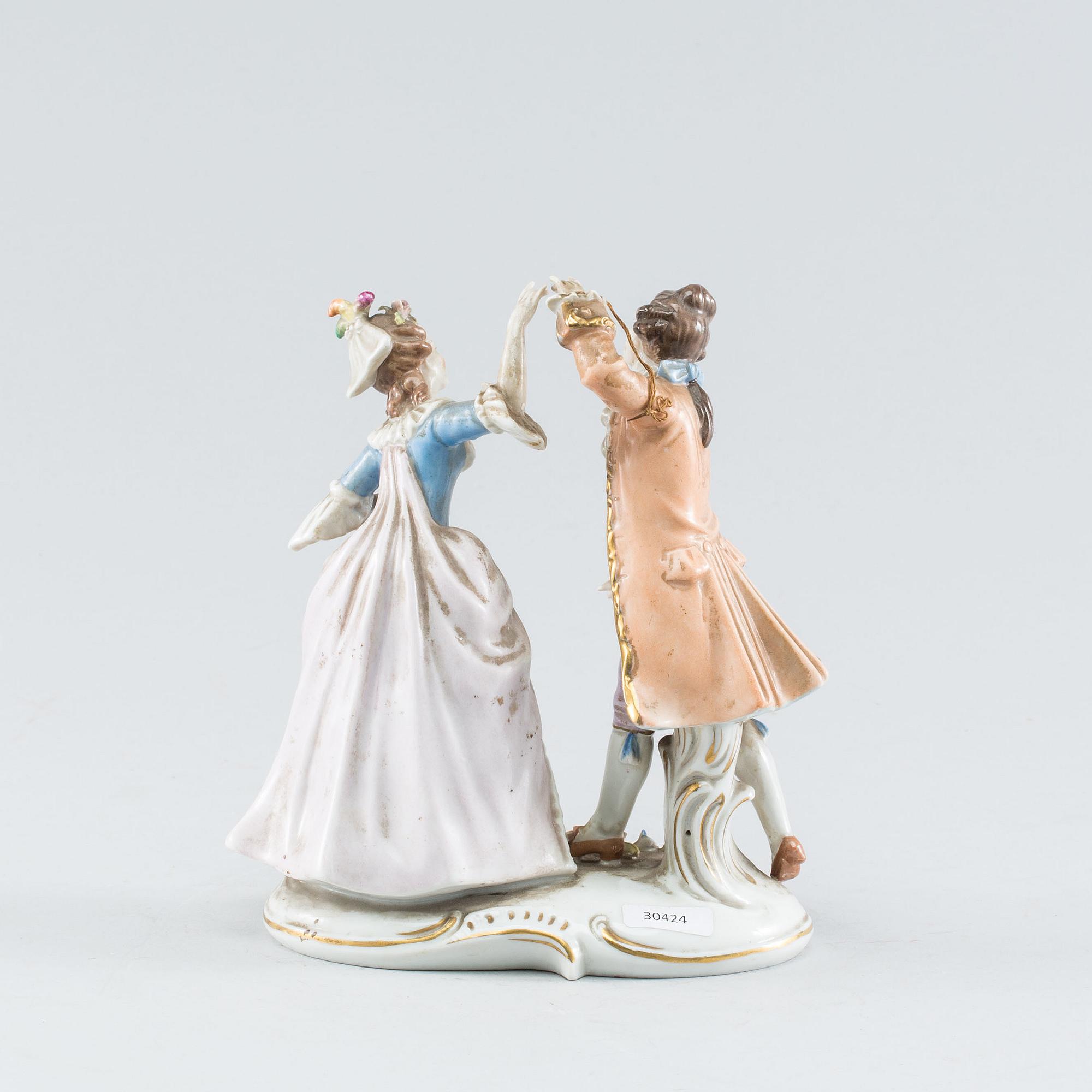 A Rococo style porcelain figure group. First half of the 20th Century.