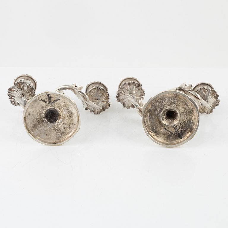 A rococo style pair of silverplated candelabras, end of the 19th Century..