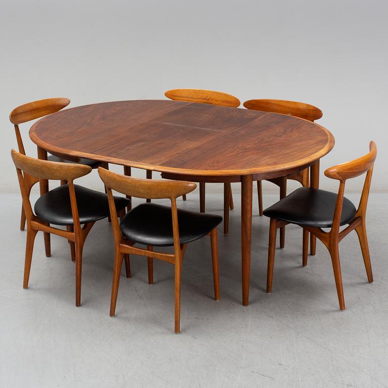 KURT ØSTERVIG, a teak dining suite with a round table and six chairs, Brande Möbelindustri, Denmark.