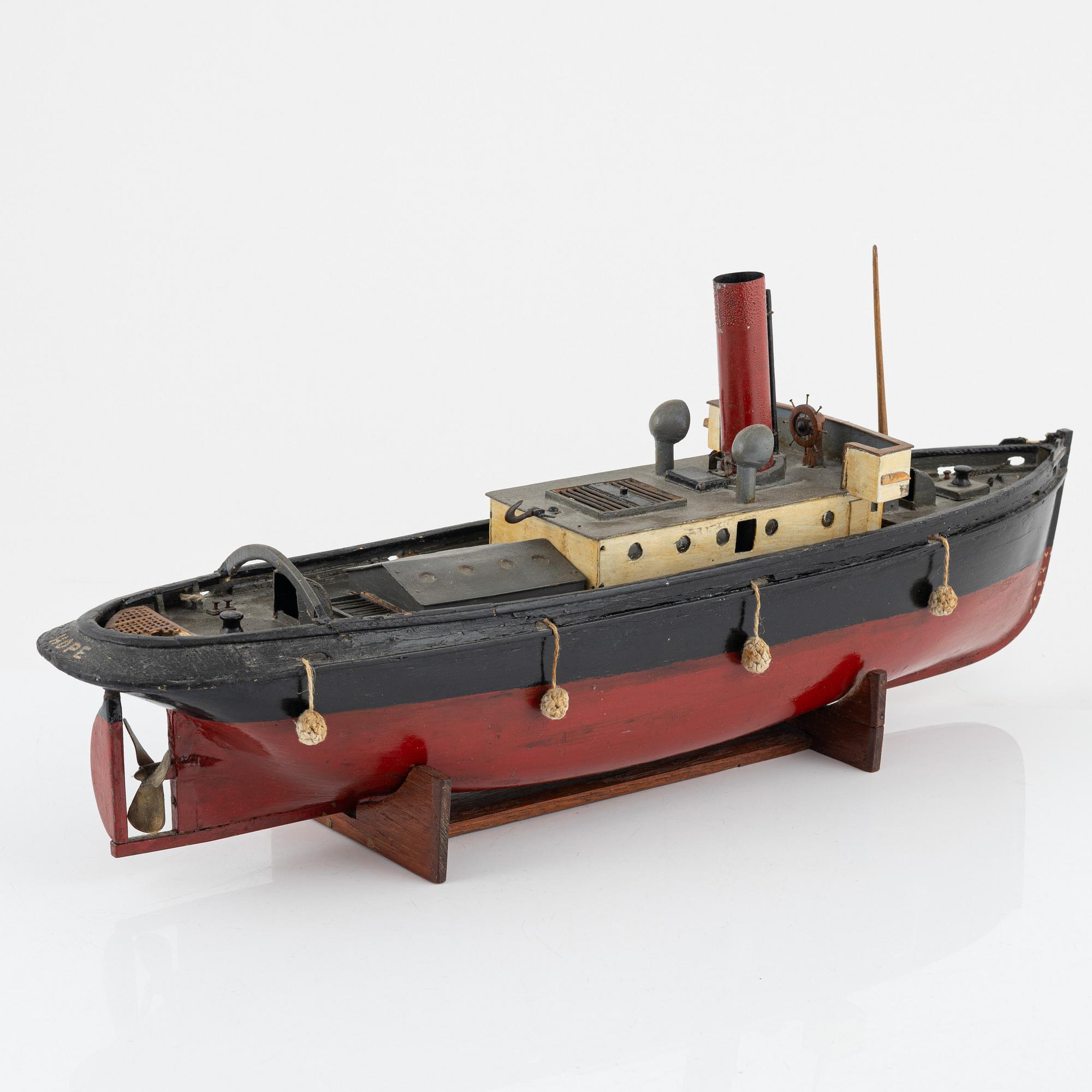 A ships model of a tugboat for a steam engine.
