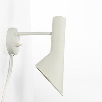 Arne Jacobsen, An 'AJ' wall lamp. Louis Poulsen, 21st century.