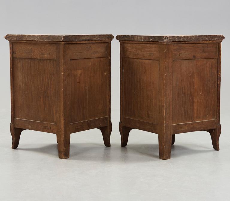 A pair of Louis XV 18th century corner cupboards.