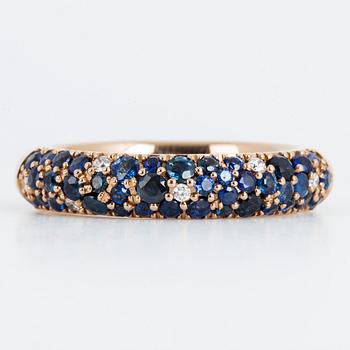 An enamel and brilliant cut diamond ring.