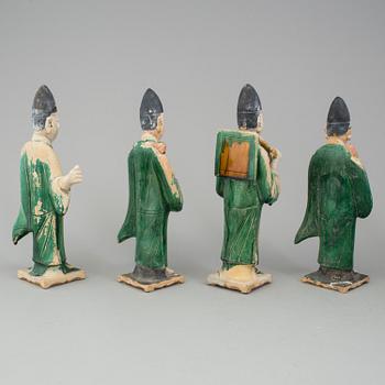 A group of eight chinese figures with three objects, earthenware, Ming dynasty.