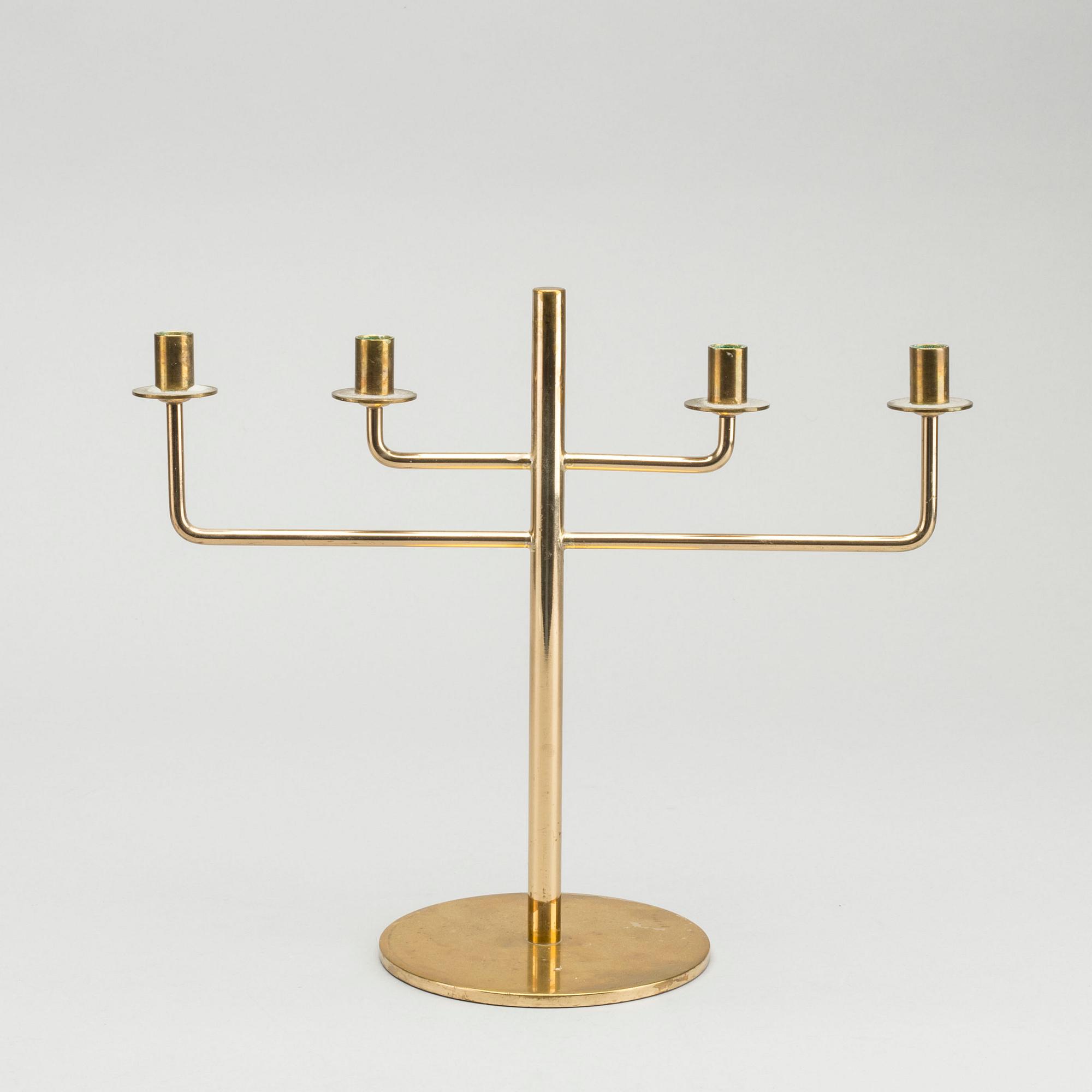HANS-AGNE JAKOBSSON,  a brass candelabra, later part of the 20th century, height 23,5 cm.