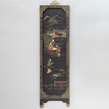 Four black-lacquered wall decorations, China, around 1900.