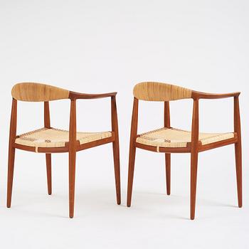 Hans J. Wegner, a pair of teak and rattan 'The Chair', JH-503, Johannes Hansen, Denmark 1950s.
