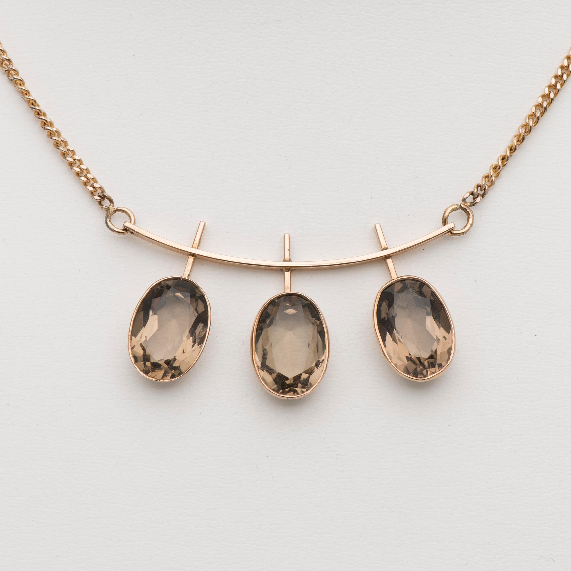 HALSSMYCKE, 14K guld, rökkvarts-imitationer. Helsingfors 1960.