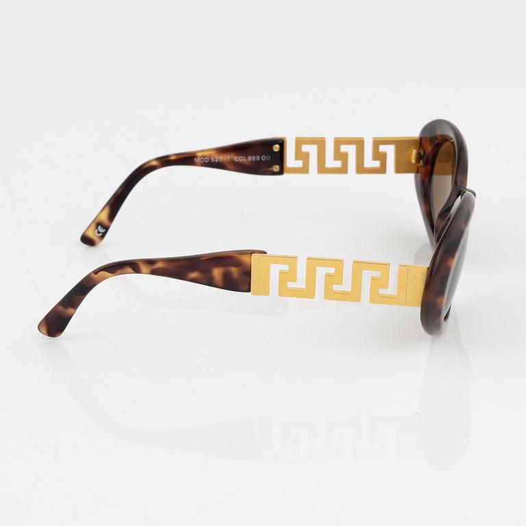 Gianni Versace, a pair of brown and gold sunglasses.