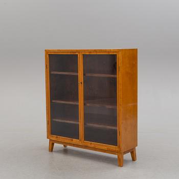 A 1940s birch cabinet.