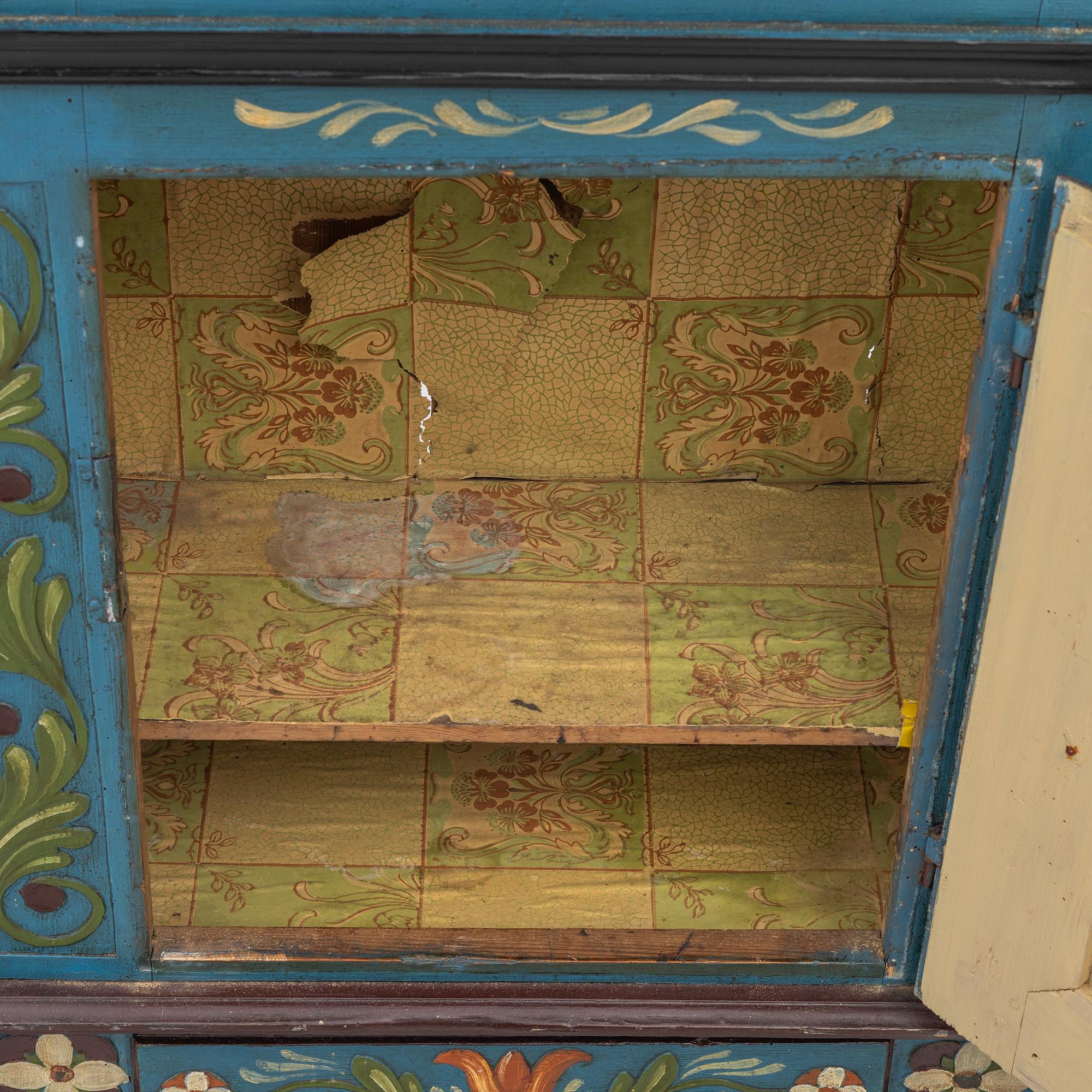A 19th century folk art hanging cabinet.