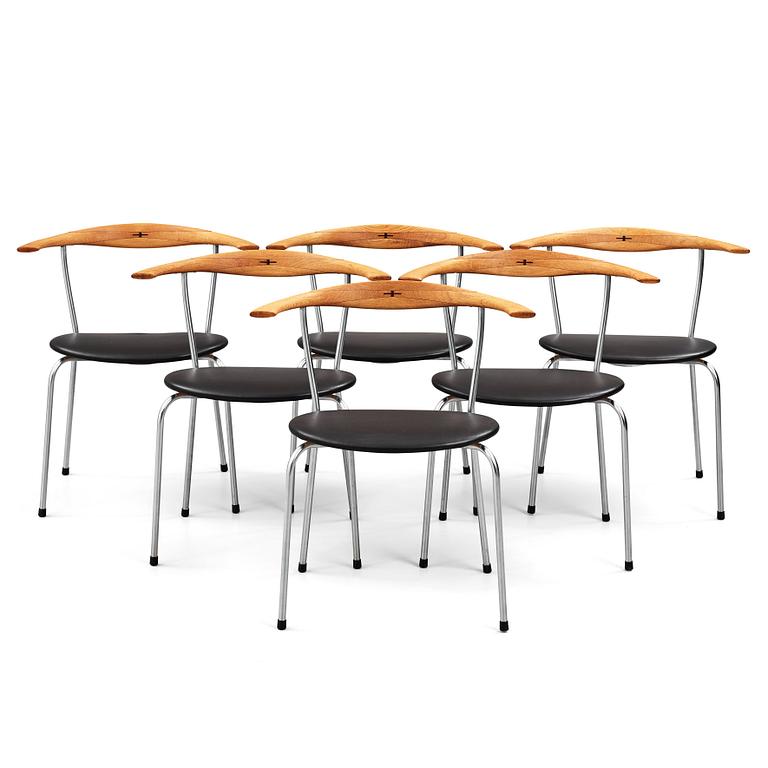 Hans J. Wegner, a set of six "JH-701" oak and black leather chairs by Johannes Hansen, Denmark.