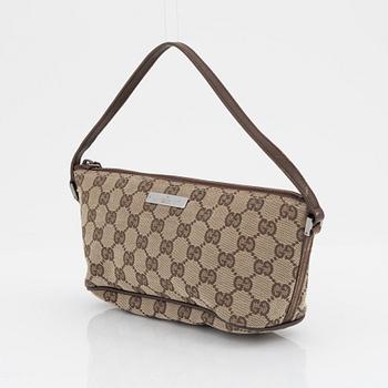 Gucci, a monogram canvas bag.