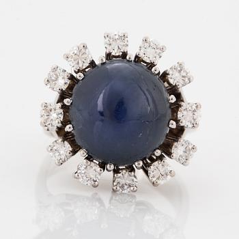 Cabochon-cut sapphire and brilliant-cut diamond cocktail ring.