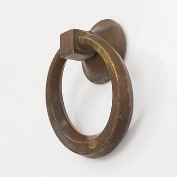 Dörrkläpp, brons, 1900-talets första hälft.