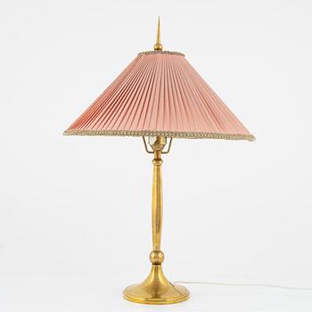 Harald Notini, a Swedish Grace '6851' brass table light, Arvid Böhlmarks Lampfabrik, Stockholm, 1920's.