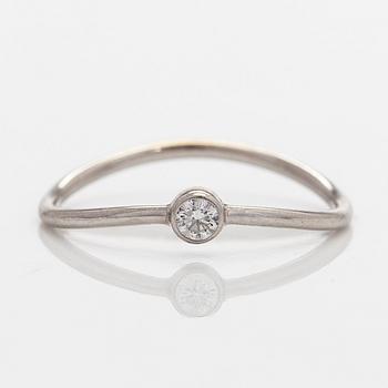 Tiffany & Co, Elsa Peretti, a platinum 'Wave' ring with a brilliant-cut diamond.