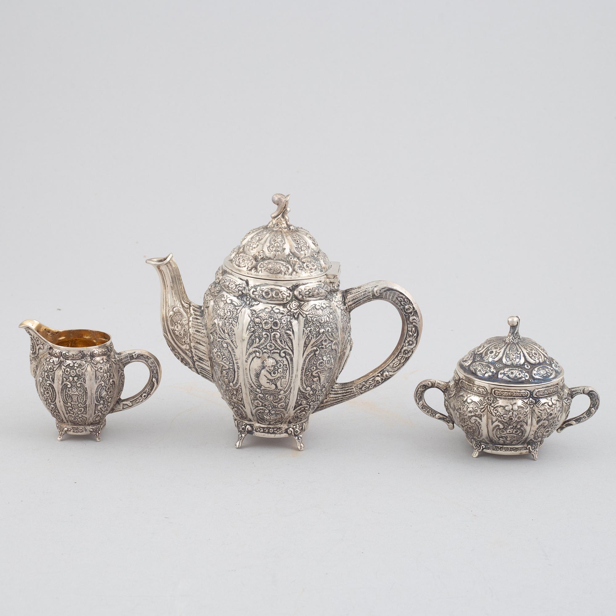 E.Jäntti, four silver cups, a three-piece silver coffee service and a silver tray, Helsinki, Finland,1979-81.