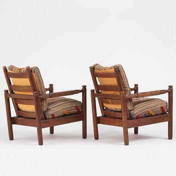 Axel Einar Hjorth, a pair of stained pine "Sandhamn" easy chairs, Nordiska Kompaniet, Sweden, 1929.