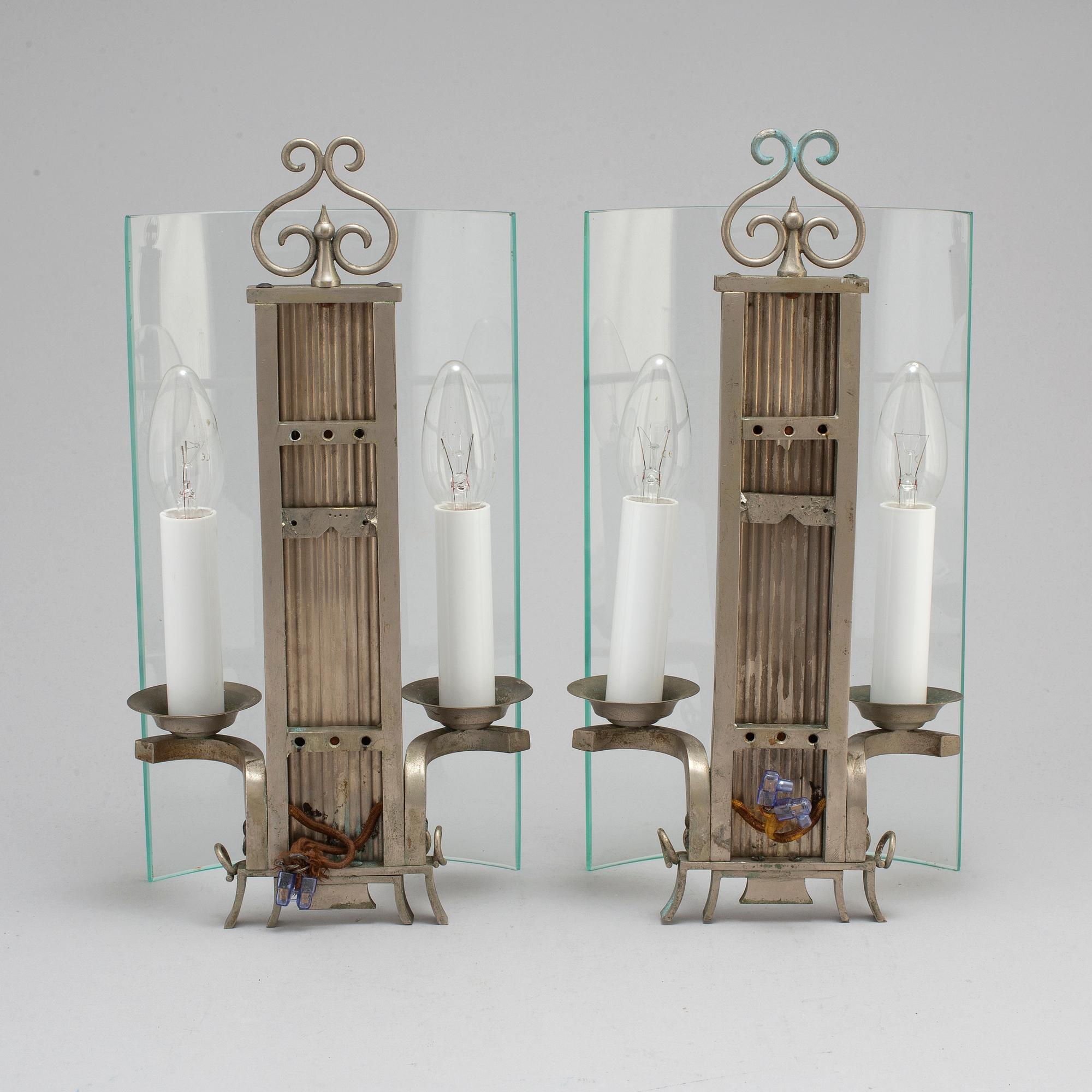 A pair of pewter wall lamps, 1920s.