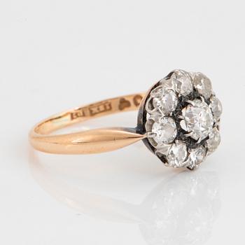 An 18K gold ring set with old-cut diamonds.