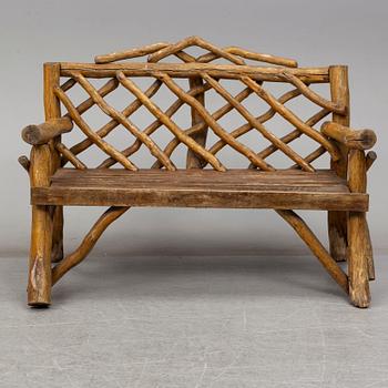 A garden sofa, table, bench and a pair of chairs, first half of the 20th century.