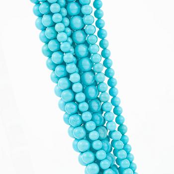 A 12-strand turquoise and wood necklace signed Trianon.