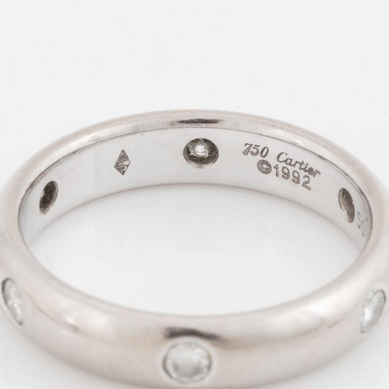 An 18K white gold Cartier ring set with round brilliant-cut diamonds.