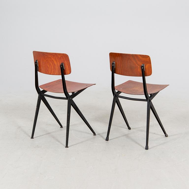 A pair of Friso Kramer Industrial 1950s chairs.