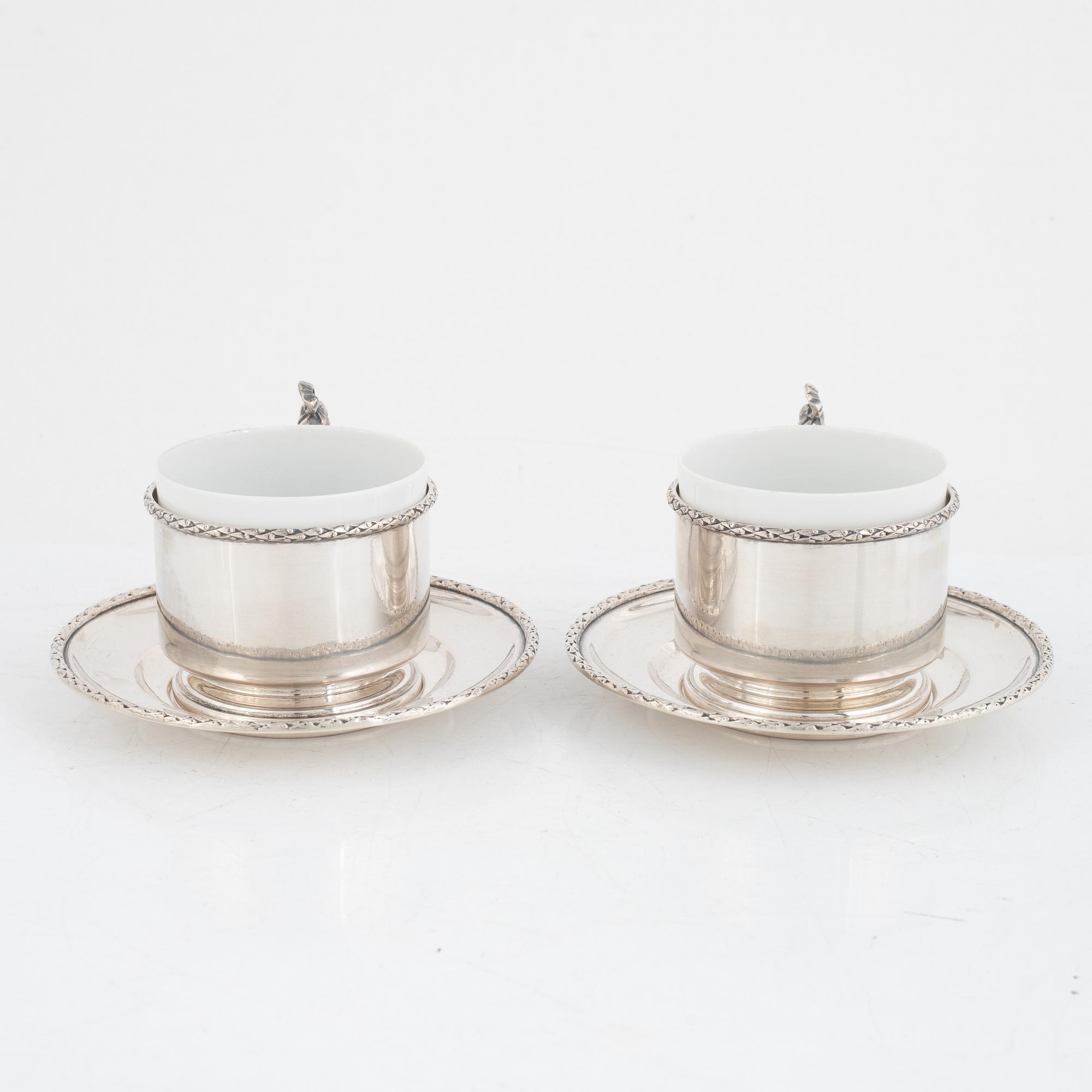 Silver tea mug holders with saucers, Pest, Austria, around 1900.