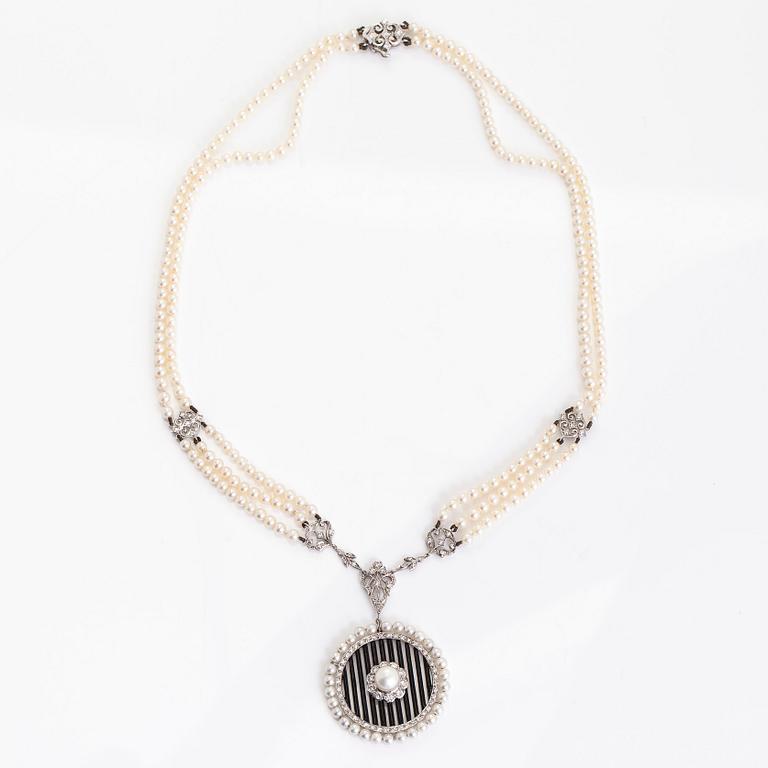 An 18K white gold necklace with cultured pearls, enamel and brilliant-cut diamonds. England.