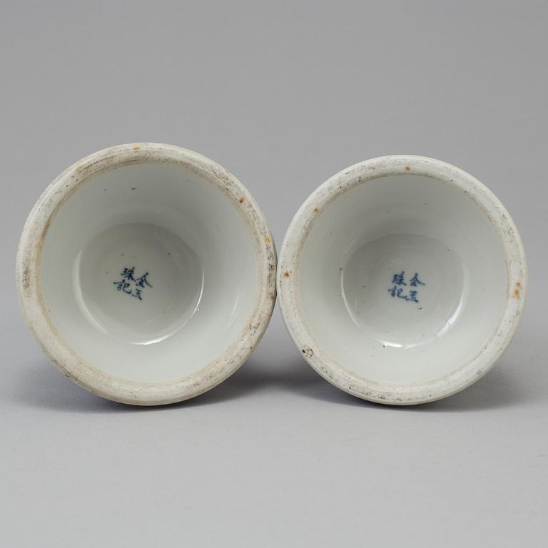 A pair of blue and white candlesticks, late Qingdynasty.