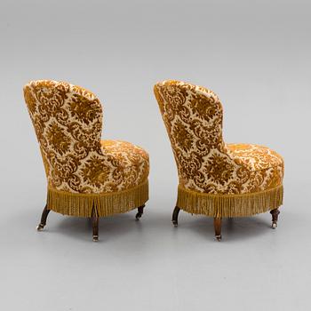 A pair of easy chairs, circa 1900.