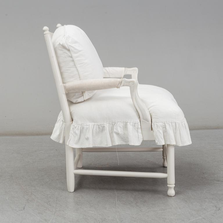 A Gustavian-style late 20th century armchair.