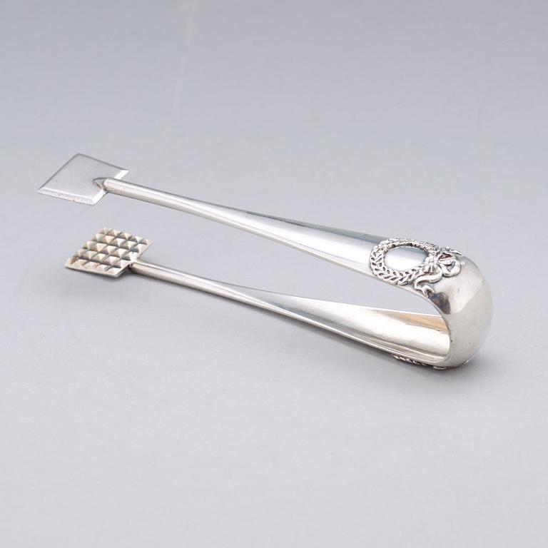 A Fabergé 20th century silver sugar-tongs, work master Anders Michelsen 1908-1917. Imperial Warrant.