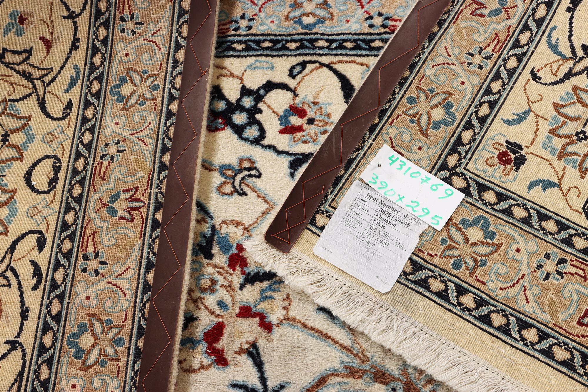 A Nain carpet, part silk, 9 laa, c. 390 x 295 cm.
